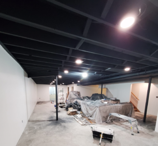 Dryfall coating applied to basement ceiling for a clean finish.