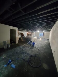 Basement ceiling treated with dryfall coating.