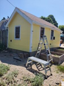 Power washed and painted the exterior of the massage studio.