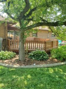 Power washed deck and coated with 2 layers of semi-solid stain.