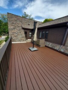 Deck power washed and finished with 2 coats of semi-solid stain in 2 colors.