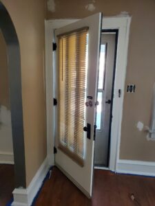 Stained trim refinished to enamel, walls repaired and coated with 2 layers of Super Paint.