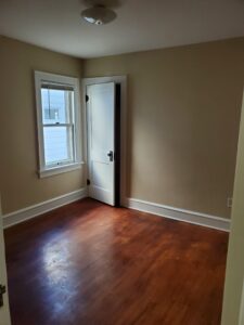 Stained trim converted to painted enamel, walls repaired and finished with 2 coats of Super Paint.