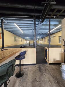 Transformed Mac's Pet Depot BARk Park with professional dryfall ceiling painting.