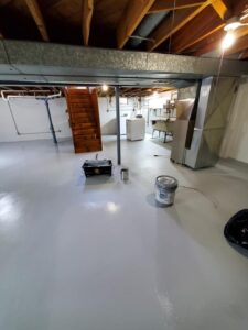 Applied 2 coats of Drylok to walls, 2 coats of Armorseal to floor, and 2 coats of enamel to support beams.