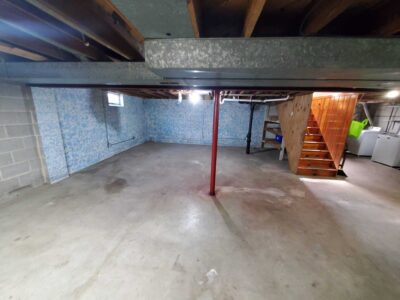 2 coats of Drylok on walls, Armorseal on floor, and enamel on beams for a clean, durable finish.