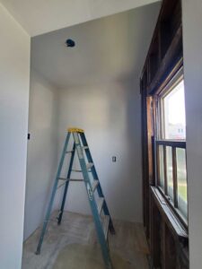 Framed, hung drywall, and primed in the kitchen.