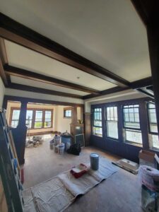 Plaster walls repaired, skim coated, and primed with two coats.